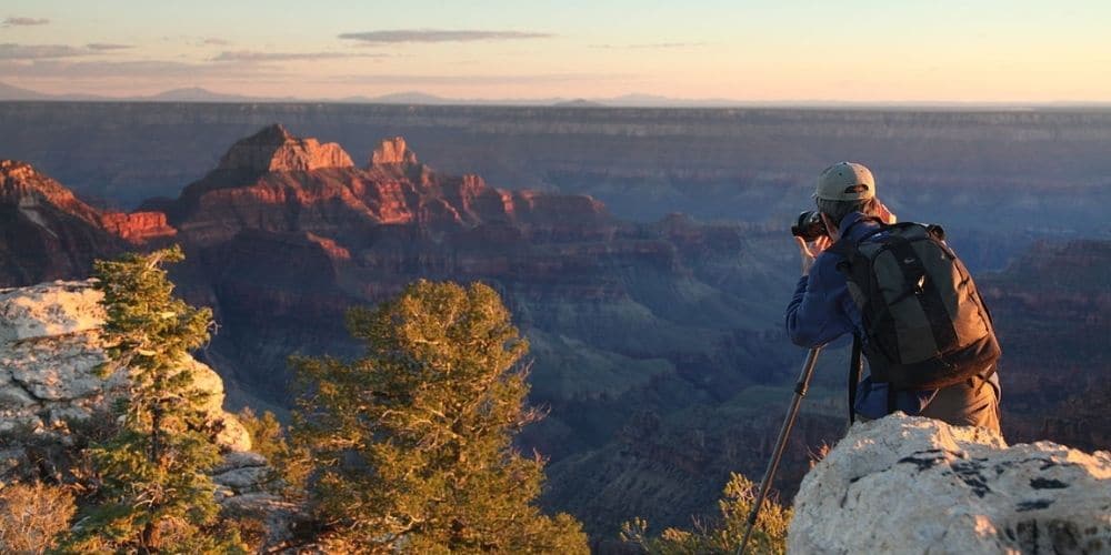 photographer taking picture of grand canyon